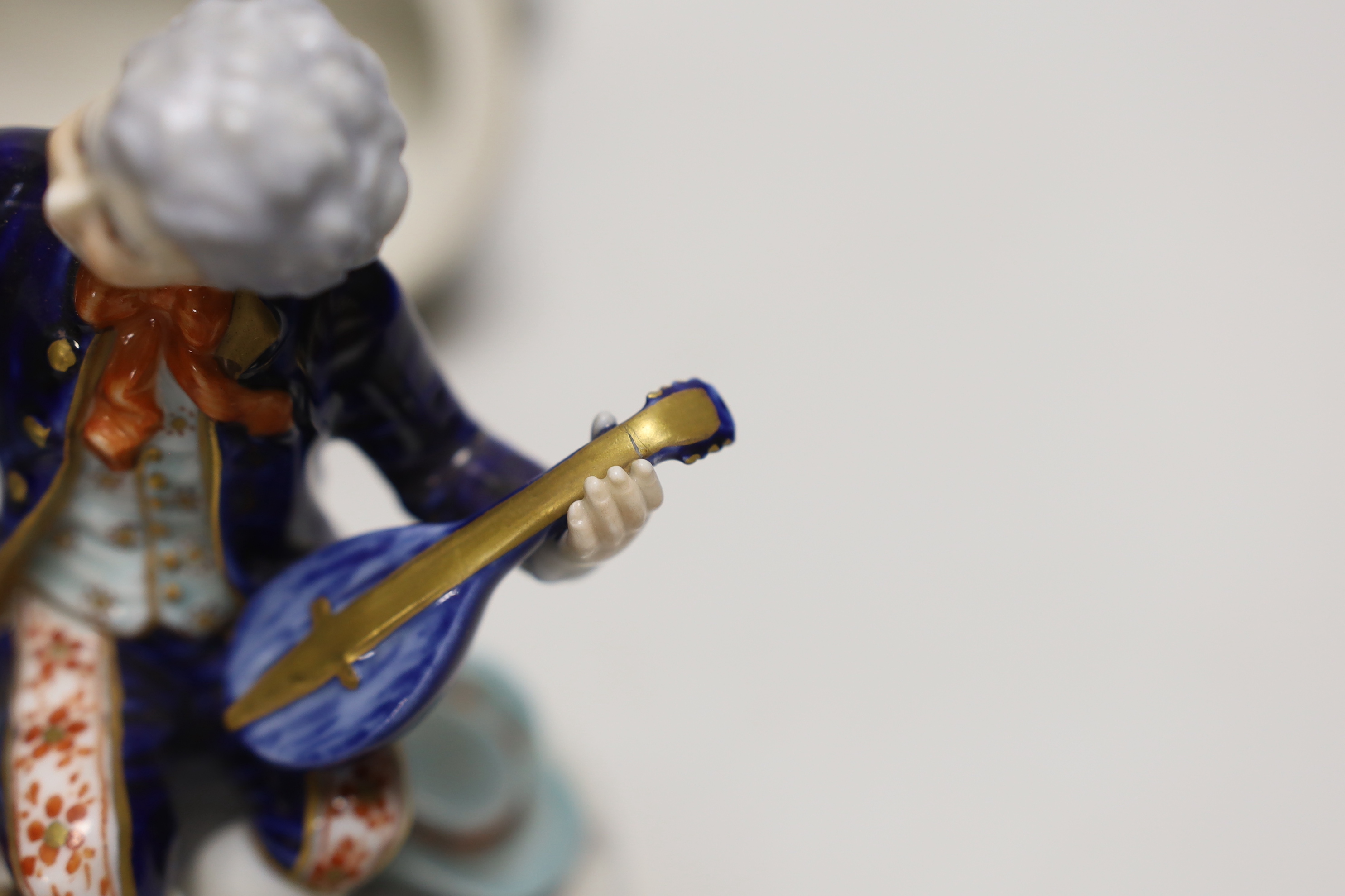 Two German porcelain figure groups and figural salt, tallest 17cms high